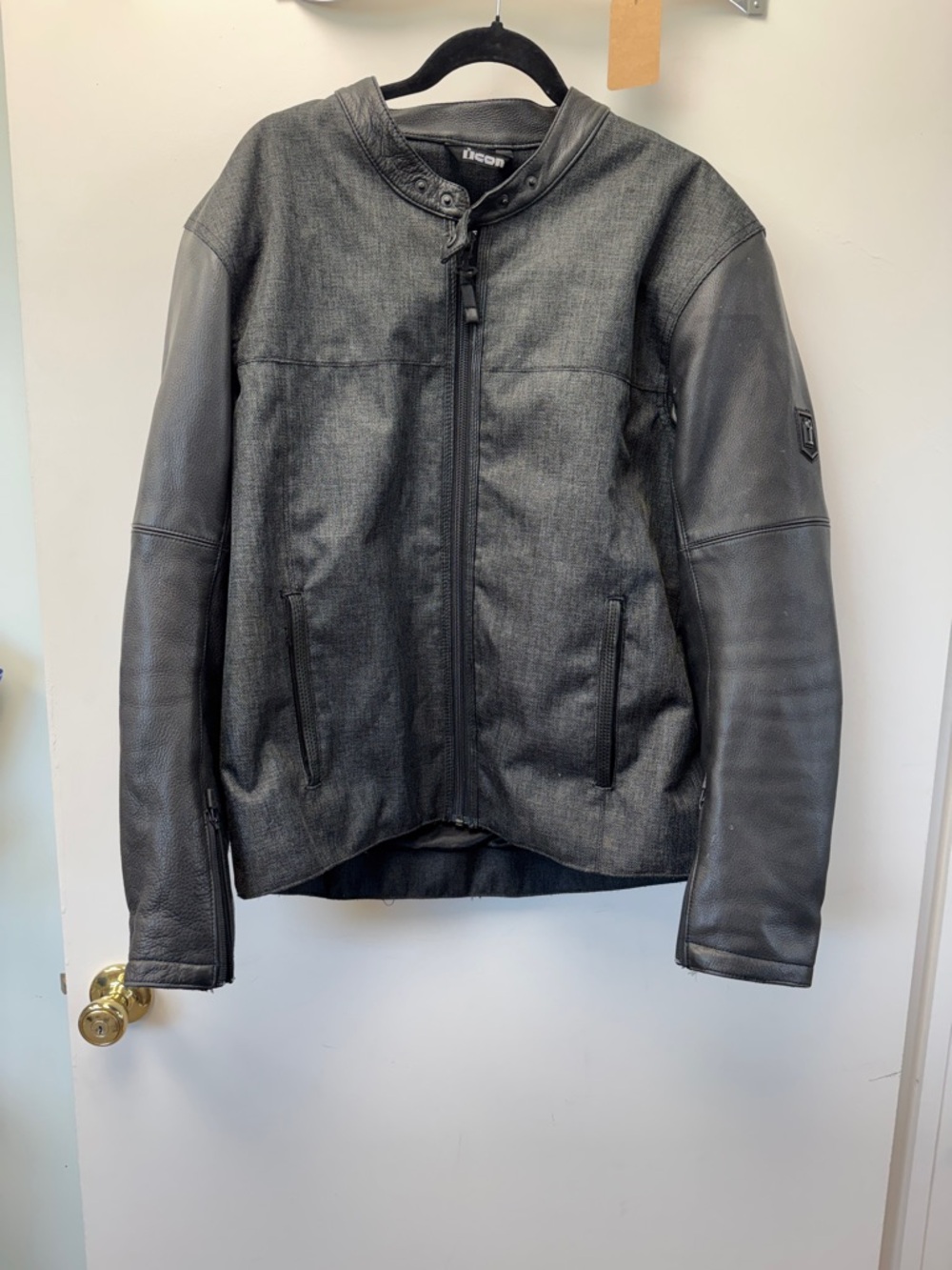 ICON Men’s Black Textile Body with Black Leather Sleeve Motorcycle Jacket